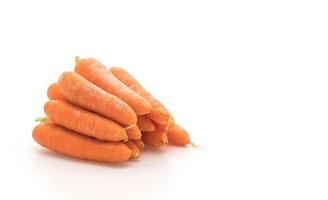 baby morötter på vit bakgrund foto