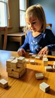 en ung barn använder sig av block till lära sig grundläggande räkning och matematik Kompetens. foto