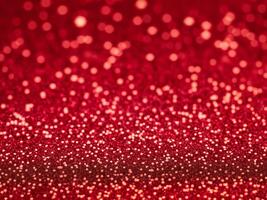 röd jul glitter bakgrund med stjärnor. festlig lysande suddig textur. foto