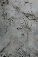 ojämn cement och sand vägg textur bakgrund, grungy cement vägg yta, rustik sand vägg foto