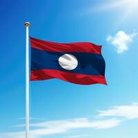 vinka flagga av laos på flaggstång med himmel bakgrund. foto