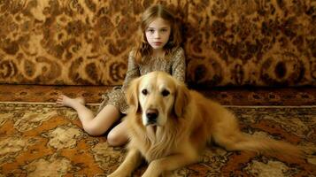 en flicka och en gyllene retriever hund på en matta foto