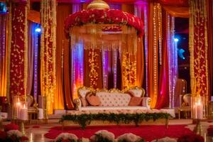 ett indisk bröllop skede dekorerad med röd och guld. ai-genererad foto