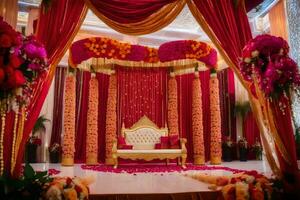 ett indisk bröllop skede dekorerad med röd och guld blommor. ai-genererad foto