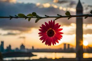 en röd blomma är hängande från en gren i främre av en stad horisont. ai-genererad foto