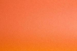 tomt kopieringsutrymme från färgat papper. orange färgarkbakgrund foto
