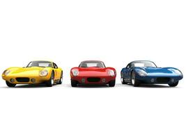 Fantastisk årgång sporter bilar i primär färger foto