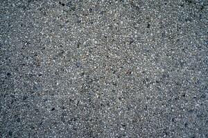 många små och grå stenar, sömlös textur foto