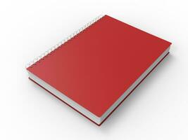 Häftigt röd spiral bindande anteckningsbok foto