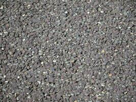asfalt jord mönster, naturlig sten textur, väg trottoar bakgrund foto