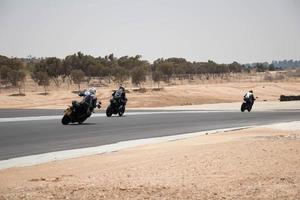 stad, land, mmm dd, åååå - motorcykeltävling på en racerbana foto