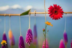 färgrik blommor hängande från en rep med bergen i de bakgrund. ai-genererad foto