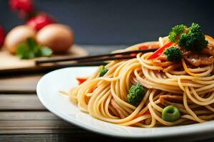 en tallrik av spaghetti med broccoli och ätpinnar. ai-genererad foto