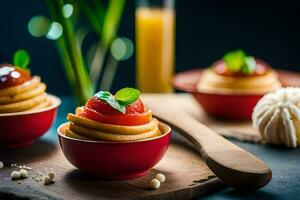 tre små desserter i röd skålar med frukt på topp. ai-genererad foto