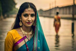 en skön indisk kvinna i en sari stående i de vatten. ai-genererad foto
