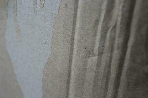 trasig papper bakgrund med detaljer, grungy brun papper yta, rustik papper textur foto