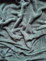 textur, mönster, bakgrund svart handdukar utsatt till solljus foto