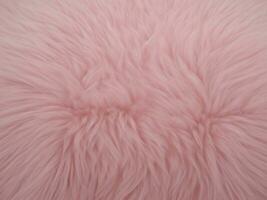 mjuk fluffig rosa päls. djur- päls, pastell rosa bakgrund, bakgrund för text och foton. ai generativ foto