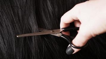 peruk och sax - svart peruk - frisyrbakgrund foto
