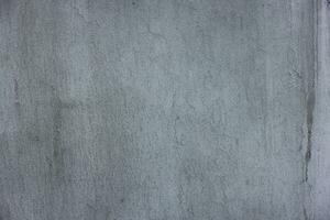 betong utomhus- vägg med matt grå måla och fläckar - full ram bakgrund och platt textur foto