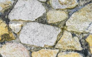 textur detalj av vägg med stenar stenar tegel tegelstenar Mexiko. foto