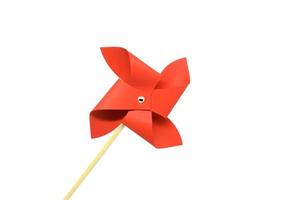 rött pinwheel på en vit bakgrund. leksak för barn. foto