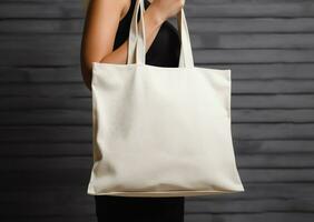 kvinna innehav tom tömma duk väska för handla, eco vänlig koncept, ai genererad foto