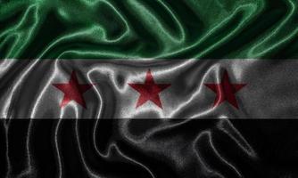 tapet av Syrien flagga och viftande flagga av tyg. foto