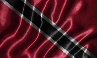 tapet av trinidad och tobago flagga och viftande flagga av tyg. foto