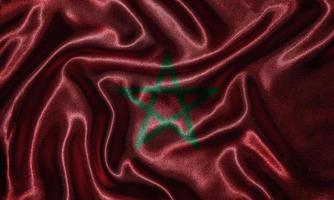tapeter av marockos flagga och viftande flagga av tyg. foto