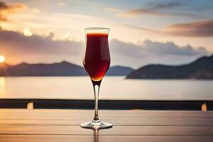en glas av röd vin på en tabell i främre av de hav. ai-genererad foto