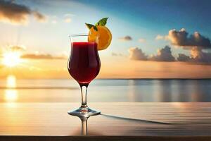 en glas av röd cocktail på en tabell i främre av de hav. ai-genererad foto