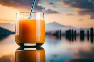en glas av orange juice med en sugrör på de kant av en sjö. ai-genererad foto