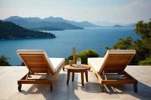 strand stolar på de terrass av en lyx villa utsikt de hav, två däck stol på terrass med slå samman och fantastisk hav se, ai genererad foto