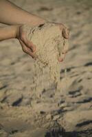 sand tid hand foto