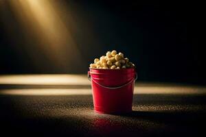 en röd hink fylld med popcorn på en mörk yta. ai-genererad foto