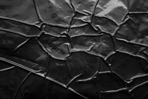 svart skrynkliga och skrynkligt plast affisch textur bakgrund foto