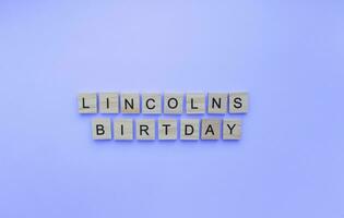 februari 12, Abraham Lincolns födelsedag, minimalistisk baner med de inskrift i trä- brev foto