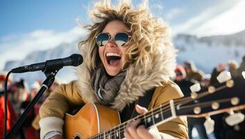 ung kvinna spelar gitarr och sång på de skede i de snöig berg. ai genererad. foto