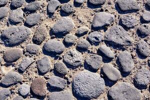 en stänga upp av en sten golv med många annorlunda stenar foto