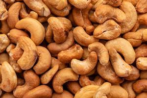 cashewnötter på nära håll. den kan användas som bakgrund foto