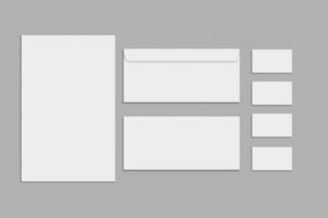 tom brevpapper och företags- identitet uppsättning på grå bakgrund. branding mock-up. foto