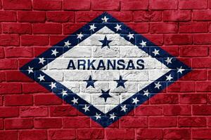 flagga av Arkansas stat USA flagga på en texturerad bakgrund. begrepp collage. foto