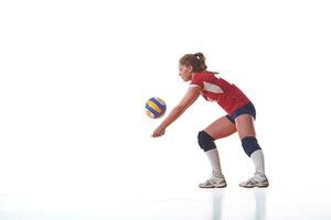 kvinna spelar volleyboll foto