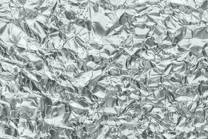 glänsande metall silvergrå folie skrynklig textur bakgrund foto