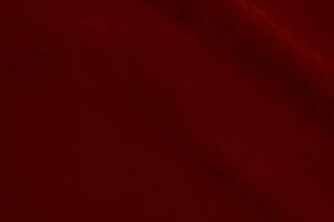 röd silke tyg textur Begagnade som bakgrund. röd panne tyg bakgrund av mjuk och slät textil- material. krossad sammet .lyx scharlakansrött för sammet.. foto