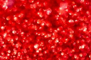 röd gnistrande glitter bokeh bakgrund. foto