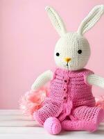 ai genererad stickat kanin i rosa klänning. st. hjärtans dag dekor. stickat leksak, amigurumi. valentines dag hälsning kort ai genererad foto