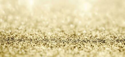 abstrakt guld glitter gnistra med bokeh bakgrund foto