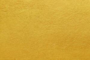 glänsande gula blad guldfolie textur bakgrund foto